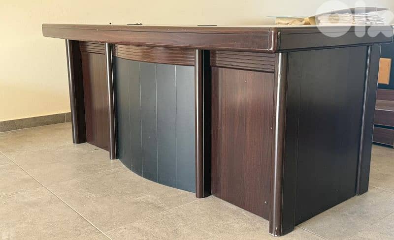 Manager's office with extension ,chair, and a regular desk 0