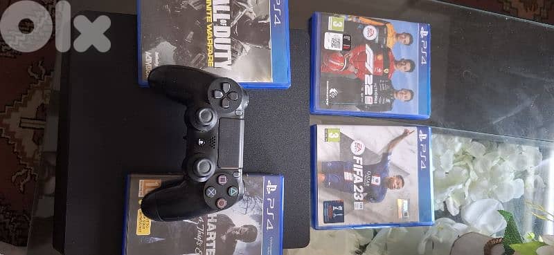 Playstation 4 +4 cds+1 controller 0