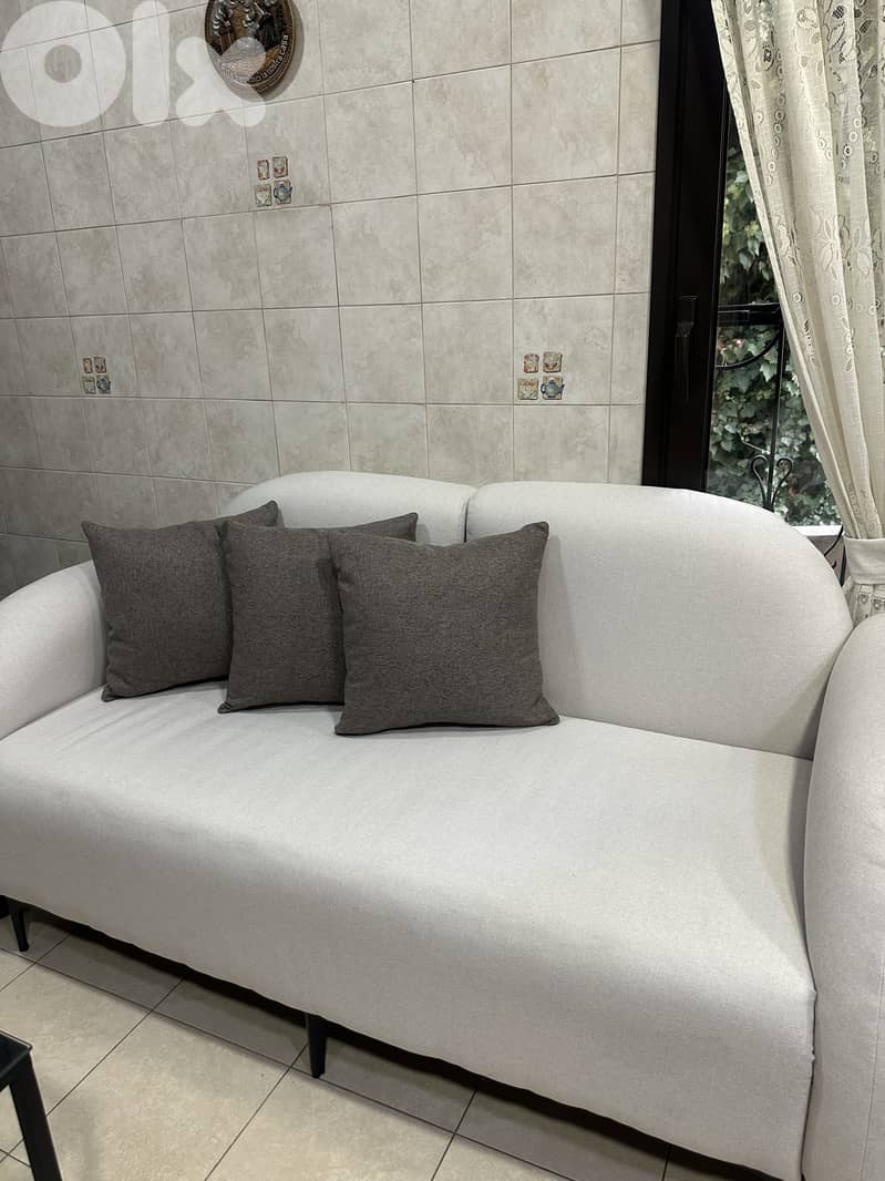 2 beige sofas (one is a 2 seater and the other is a 3 seater) 1