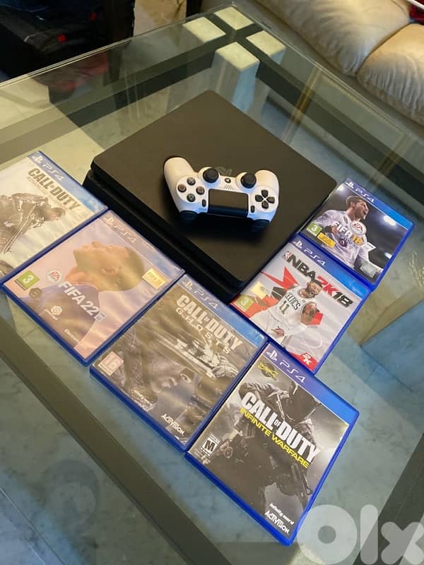 PS4 slim used like new +6 CDs + Controller+HDMI cable 0