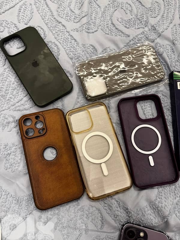 iphone 14 pro max with covers, protection and charger 4