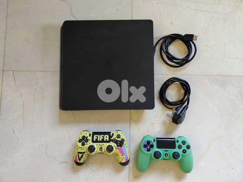 Used ps4 slim 1TB with 2 controllers and 9 games 0