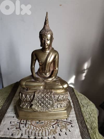 vintage brass Thai Buddha statue made from bronze.