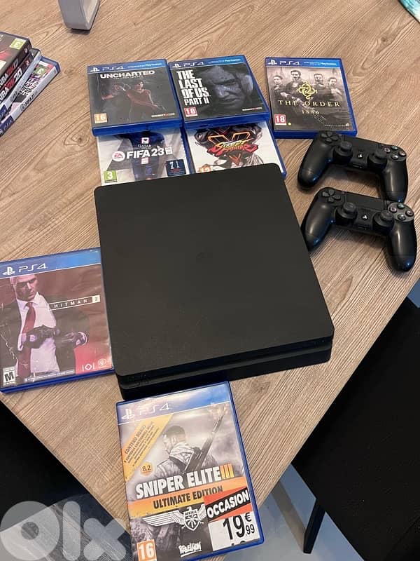 PlayStation 4 Slim – 500GB storage – includes 2 original controllers. 0