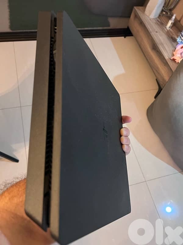 PlayStation 4 Slim – 500GB storage – includes 2 original controllers. 2