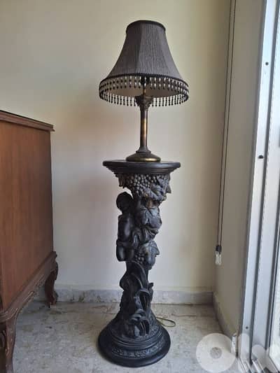Antique statue with lamp