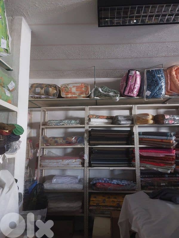 تصفية محل أقمشة وألبسة أطفال وبياضات 4