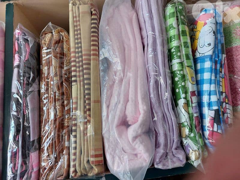 تصفية محل أقمشة وألبسة أطفال وبياضات 10