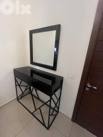 Console table with a wall mounted mirror