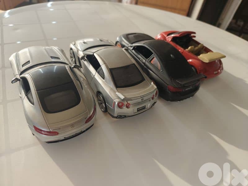 maisto 1/24, 4 cars,new beetle,nissan gtr,mercedes amg gt,bmw m4-gts 3