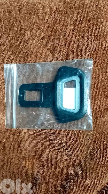 Safety belt alarm deactivator and bottle opener 1