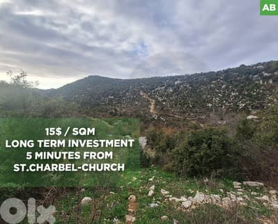 Charming green land own a 14264 m² plot in Hjoula, Jbeil. REF#AB117148