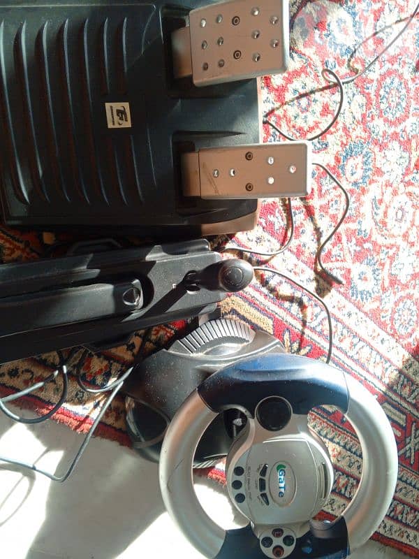 PS2 driving wheel and pedals and a hand brake 0