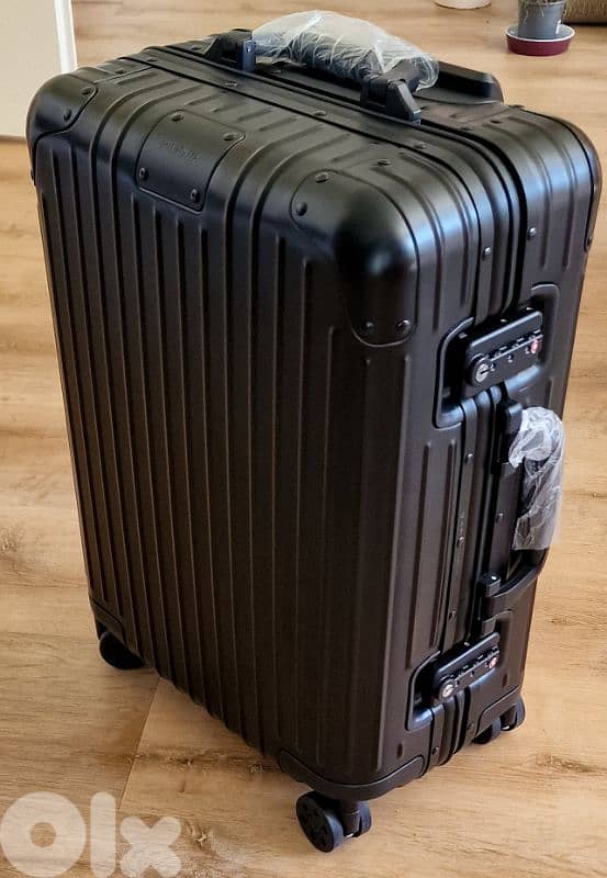 Rimowa suitcase with papers 0