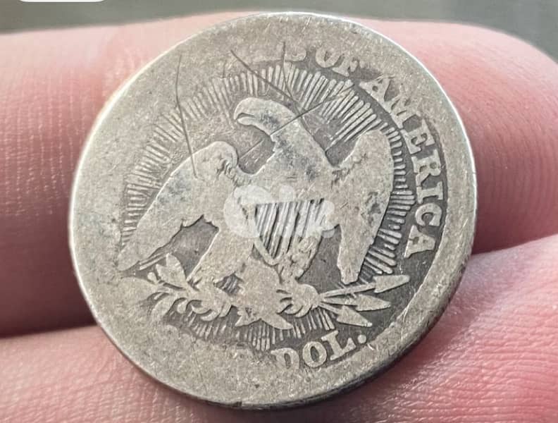 عملة فضة ربع دولار أمريكي سنة ١٨٥٣ مع شعاع seated liberty 1