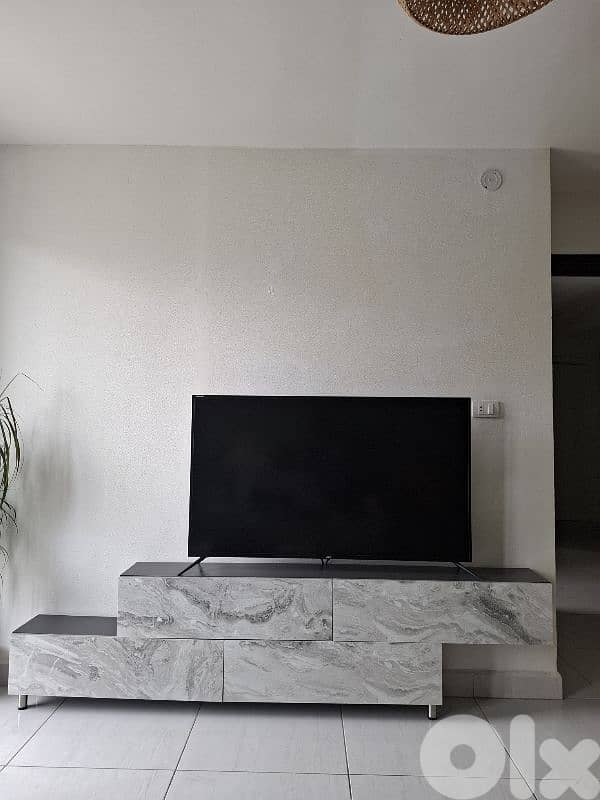 Modern TV unit in good condition Price: $100. 2