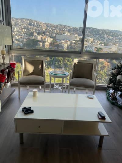 two chairs small table and big table