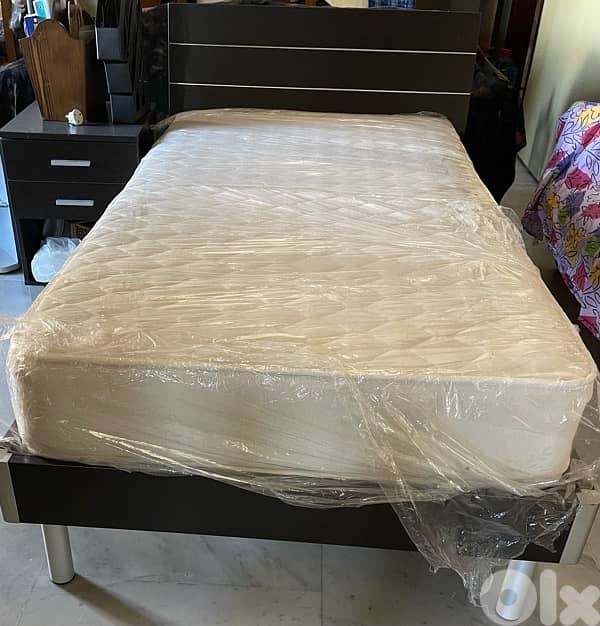 bed mattress and side table 0