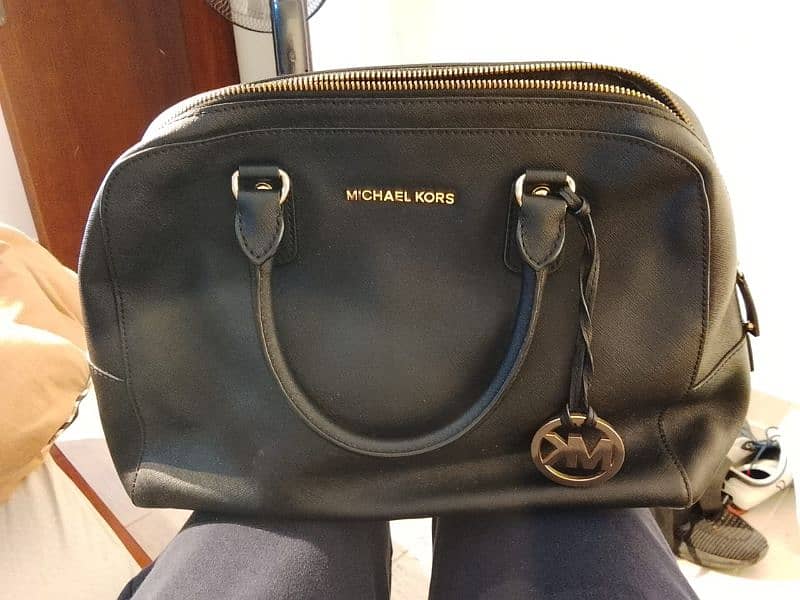 Louis Vuitton, Michael Kors, Yves Saint Laurent 0