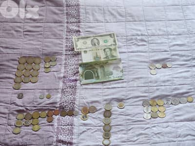 تشكيلة عملات من عدة دول بتواريخ مختلفة
