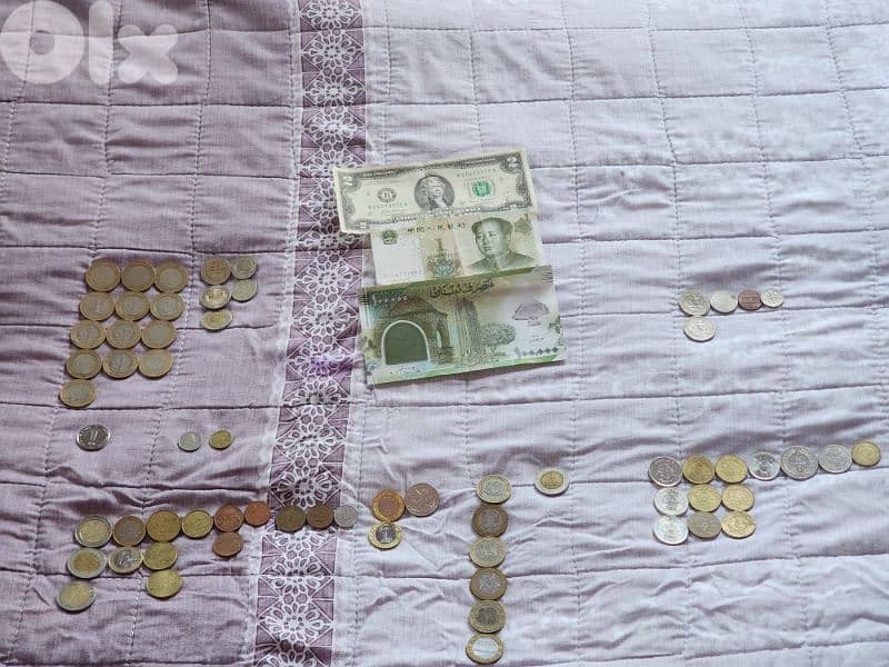تشكيلة عملات من عدة دول بتواريخ مختلفة 0