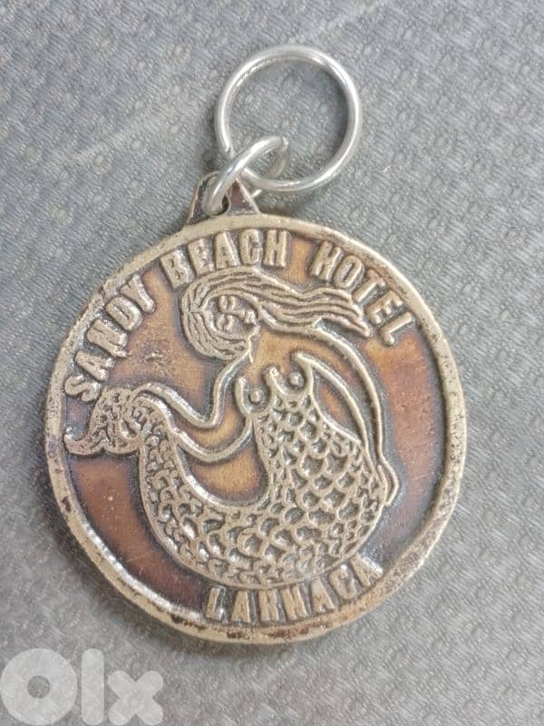 قبرص لارنكا فندق ساندي بيتش ملصق أمتعة برونزية 0