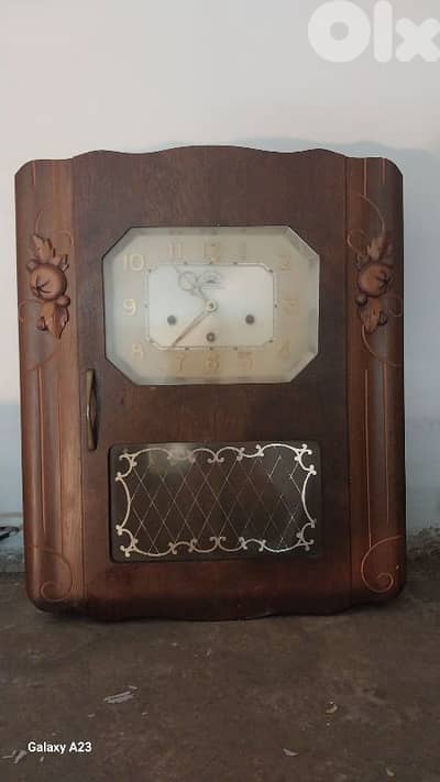 ساعة حيط خشب