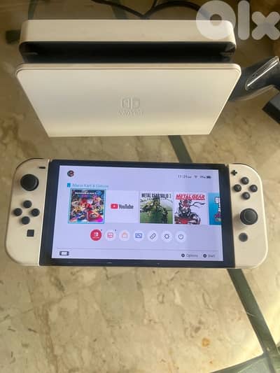 Nintendo Switch OLED excellent condition + games + memory card