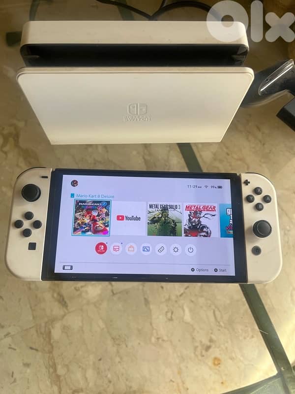 Nintendo Switch OLED excellent condition + games + memory card 0