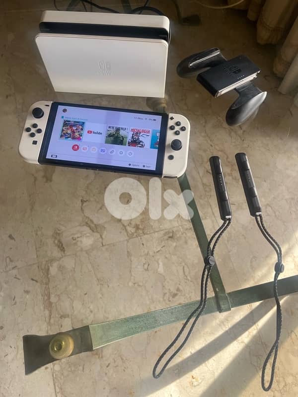 Nintendo Switch OLED excellent condition + games + memory card 1