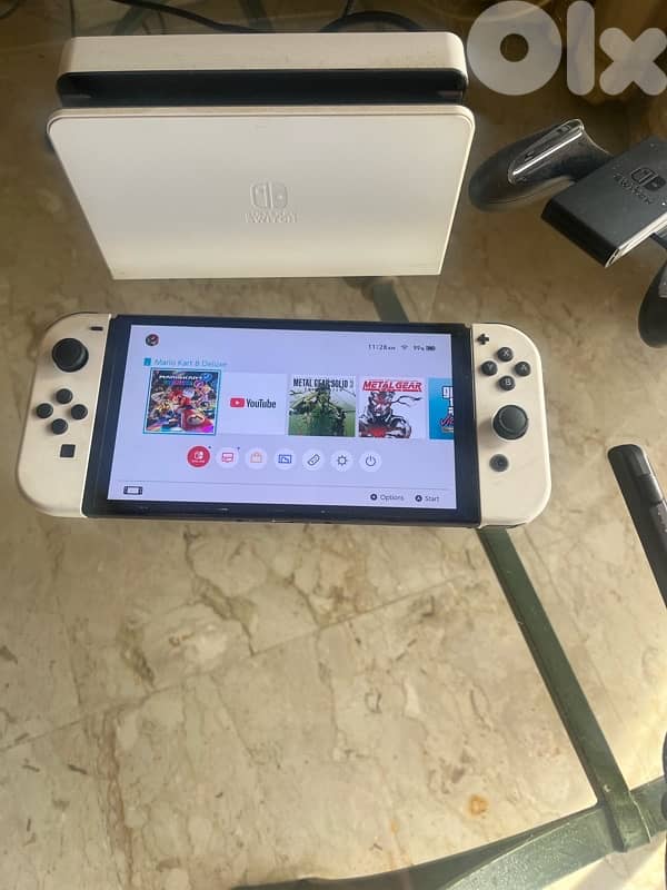 Nintendo Switch OLED excellent condition + games + memory card 2