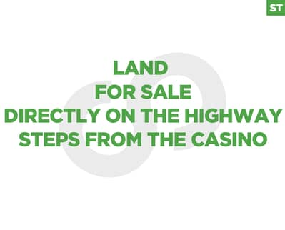 land in Adma located directly on the main highway/أدما REF#ST129985