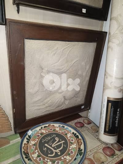 fish framed stone sculpture