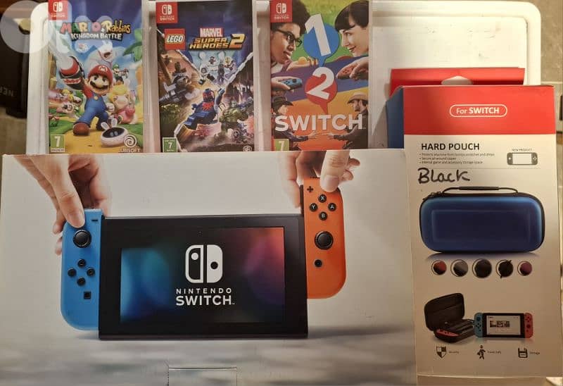 Nintendo switch + accessories + 3 games 0