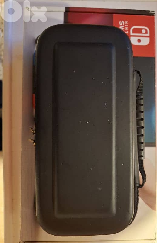 Nintendo switch + accessories + 3 games 6