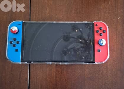 Nintendo switch Oled + Case + Picachu house case + Original charger Nintendo switch Oled + Case + Picachu house case + Original charger