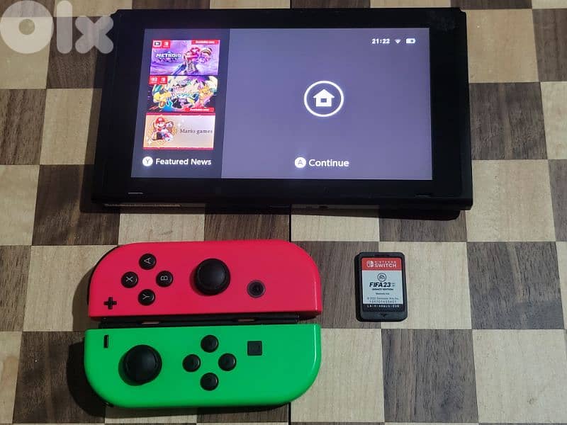 Nintendo Switch V1 + Joy-Cons + FIFA 23 2