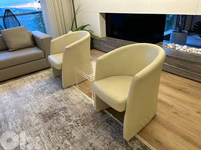 2x modern sleek arm chairs