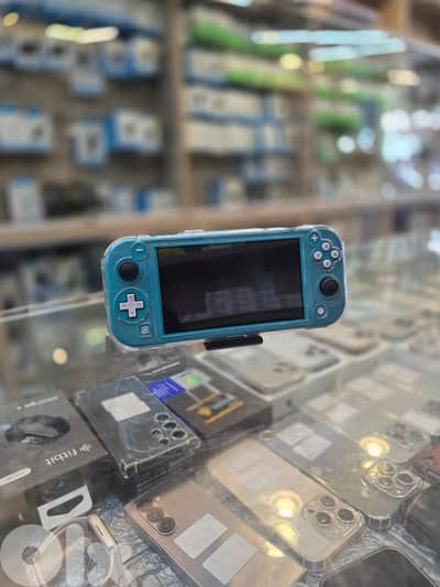 Used  nintedno switch lite  turquoise 100$