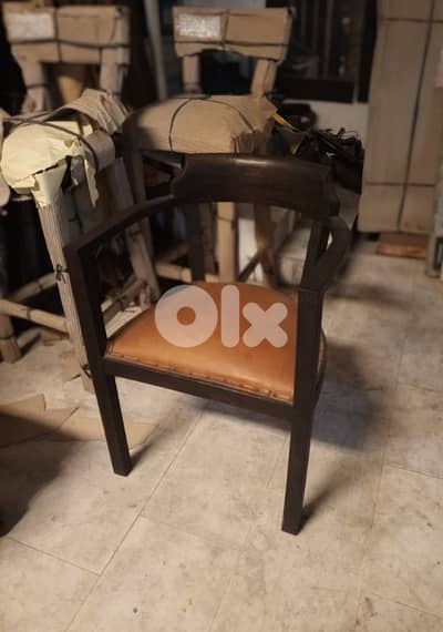 Genuine leather and teak armchair
