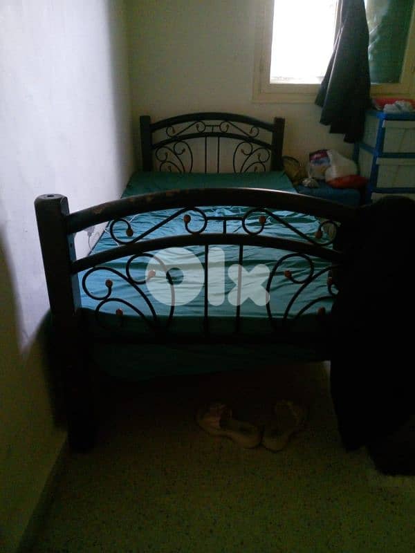 Closet along side 2 beds and a set of couches all good condition 1