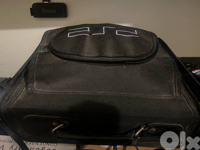 Original Sony PlayStation 2 / PS2 with original bag and 65 games CDs 1