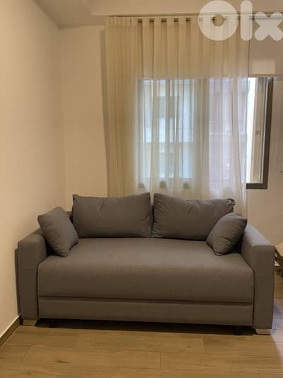 New grey big sofa and bed