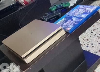 PS4 slim gold used 2 controllers and games good condition