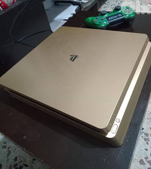 PS4 slim gold used 2 controllers and games good condition 2