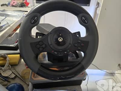 xbox one with full set (original camera, wheel and pedals) and 9 games