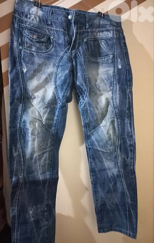 عندي ثياب مستعمله متل يلي بل صوور شروه كنزات وسوتشركم طويل وغير رجالي 13