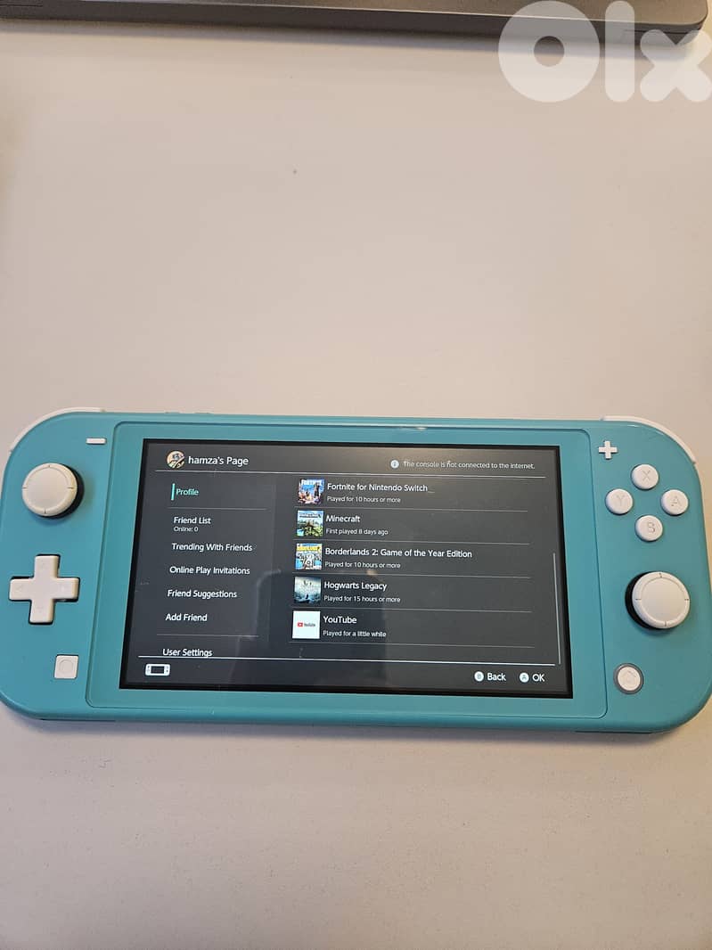 Nintendo Switch Lite with 5 games and Free Cover 4