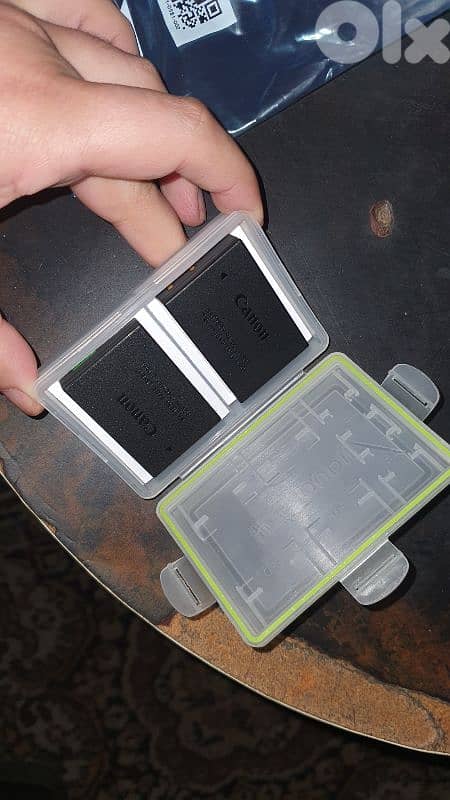 Canon R50 new in box with 2 original batteries 7