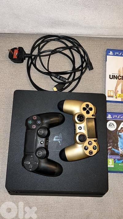PS4 slim with games and controller